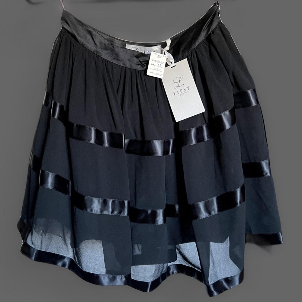 Never worn, new Lipsy London skirt in black.
